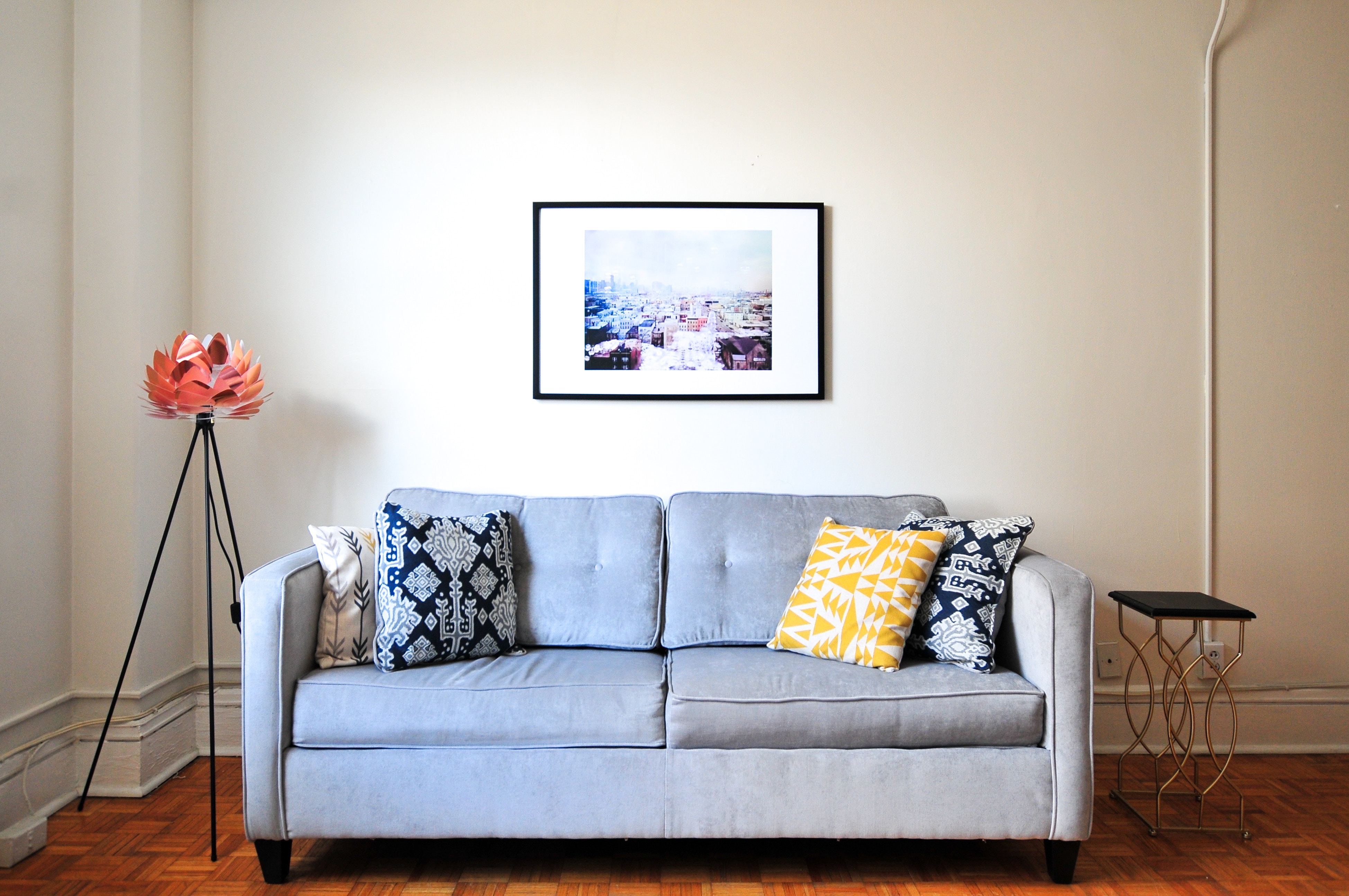 Blue sofa on a living room - how to start an airbnb business